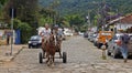 Teenager and old man in horse-drawn cart, Tiradentes, Brazil