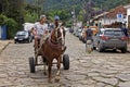 Teenager and old man in horse-drawn cart, Tiradentes, Brazil