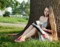 Teenager in a park with notebook