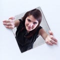 Teenager peeking out of a hole Royalty Free Stock Photo