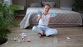 A teenager is playing with a blue slime. Concept of girl made homemade goo. Focus on the hands.