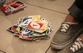Teenager playing cards on the floor. Having some fun