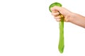 teenager playing green slime with hand, transparent toy