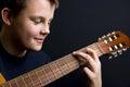 Teenager playing guitar