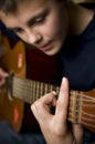 Teenager playing guitar