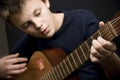 Teenager playing guitar