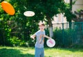 Teenager playing in the park with a plate Royalty Free Stock Photo