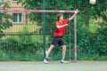 Teenager playing soccer. Playing football with a ball. Cute young boy player ready to play soccer on the indoor court Royalty Free Stock Photo