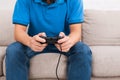 Teenager playing video games with joystick in hands Royalty Free Stock Photo