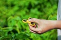 Teenager is playing a yellow spinner