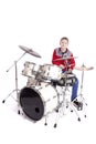 Teenager plays drums in studio with white background Royalty Free Stock Photo