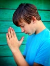 Teenager praying outdoor Royalty Free Stock Photo