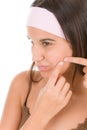 Teenager problem skin care - squeeze pimple