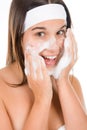 Teenager problem skin care - woman wash face Royalty Free Stock Photo