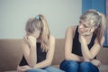 Teenager problems - Sad crying teenage girl and her worried mother