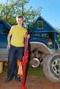 The teenager repairs the car