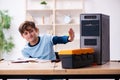 Boy reparing computers at workshop Royalty Free Stock Photo