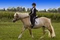 Teenager riding Horse