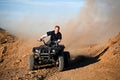 Teenager riding quad four wheeler Royalty Free Stock Photo