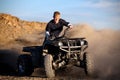 Teenager riding quad four wheeler