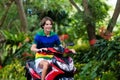 Teenager riding scooter. Boy on motorcycle. Royalty Free Stock Photo