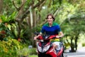 Teenager riding scooter. Boy on motorcycle. Royalty Free Stock Photo