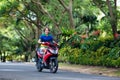 Teenager riding scooter. Boy on motorcycle.