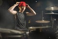 Teenager rock band musician . 13 or 14 years old cool and talented Asian American mixed ethnicity young boy playing drums Royalty Free Stock Photo