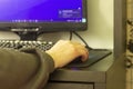 A teenager`s hand on a computer mouse, close-up Royalty Free Stock Photo