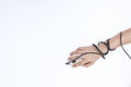 Teenager`s hand holds a computer mouse, wire around the wrist Royalty Free Stock Photo