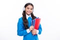 Teenager school girl wearing headphones reading a book over isolated white background. Royalty Free Stock Photo