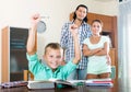 Teenager schoolboy with parents Royalty Free Stock Photo