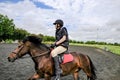 Teenager seen enjoying himself at the gallop with a pony.