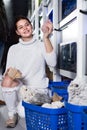 teenager selecting interesting aquarium rocks and stone for aquarium entourage