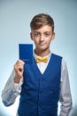 Teenager in a shirt boy holds in his hands a children`s passport Royalty Free Stock Photo