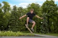 Teenager shot in the air on a skateboard in a skate park Royalty Free Stock Photo