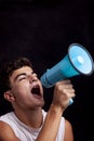 Teenager shouting with megaphone