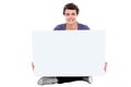 Teenager showing blank white billboard to camera Royalty Free Stock Photo