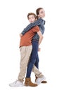 Teenager siblings hugging back on back