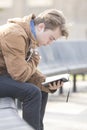 Teenager sitting on bench and praying