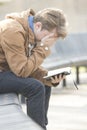 Teenager sitting on bench and praying