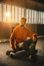 Teenager with long boards at abandoned parking