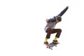 A teenager skateboarder jumps an ollie on an isolated white background. The concept of street sports and urban culture Royalty Free Stock Photo