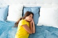 Teenager sleep in bed on pillows at home. Kid lying and sleeping on bed. Child teen sleeps in the bed. Royalty Free Stock Photo