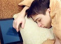 Teenager sleep with Tablet Royalty Free Stock Photo