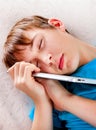 Teenager sleep with a Tablet