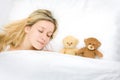 Teenager sleeping with teddies