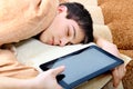 Teenager sleeps with Tablet Computer Royalty Free Stock Photo