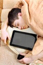 Teenager sleeps with Tablet Computer Royalty Free Stock Photo