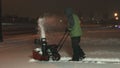 Teenager snow blowing back angle 1080p 4K UHD